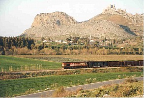 Yilankale provides a backdrop for an Adana bound freight note loco long hood forward. Photo Malcolm Peakman 1998