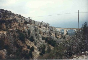 The pictures shows the old narrow gauge alignment running through tunnels on left. 1999. Photo Malcolm Peakman